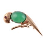 A 1950s 9 carat gold, green chalcedony and ruby parrot brooch by Hans Georg Mautner