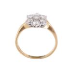 An 18 carat gold diamond cluster ring