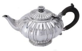 A George IV silver shaped circular tea pot by Robert Hennell II