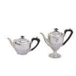 A Victorian silver oval pedestal tea pot and coffee pot by Elkington & Co.