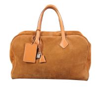 Hermès, Victoria, a brown suede travel bag