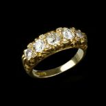 An 18 carat gold five stone diamond ring