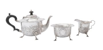 A silver shaped circular three piece tea service by S. Blanckensee & Son Ltd