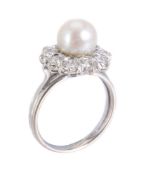 A cultured pearl and diamond cluster ring