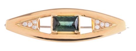 A green tourmaline and diamond brooch