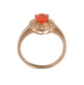 An 18 carat gold fire opal and diamond ring