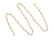 A gold coloured figaro link chain