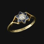A diamond and sapphire star ring