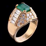 An emerald and diamond bombé dress ring