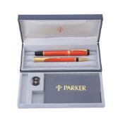 Parker, Duofold International, an orange fountain pen and propelling pencil