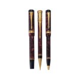 Parker, Duofold International, a red marbled fountain pen, ball point pen and propelling pencil