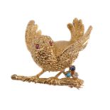 A 1970s 18 carat gold and gem set bird brooch