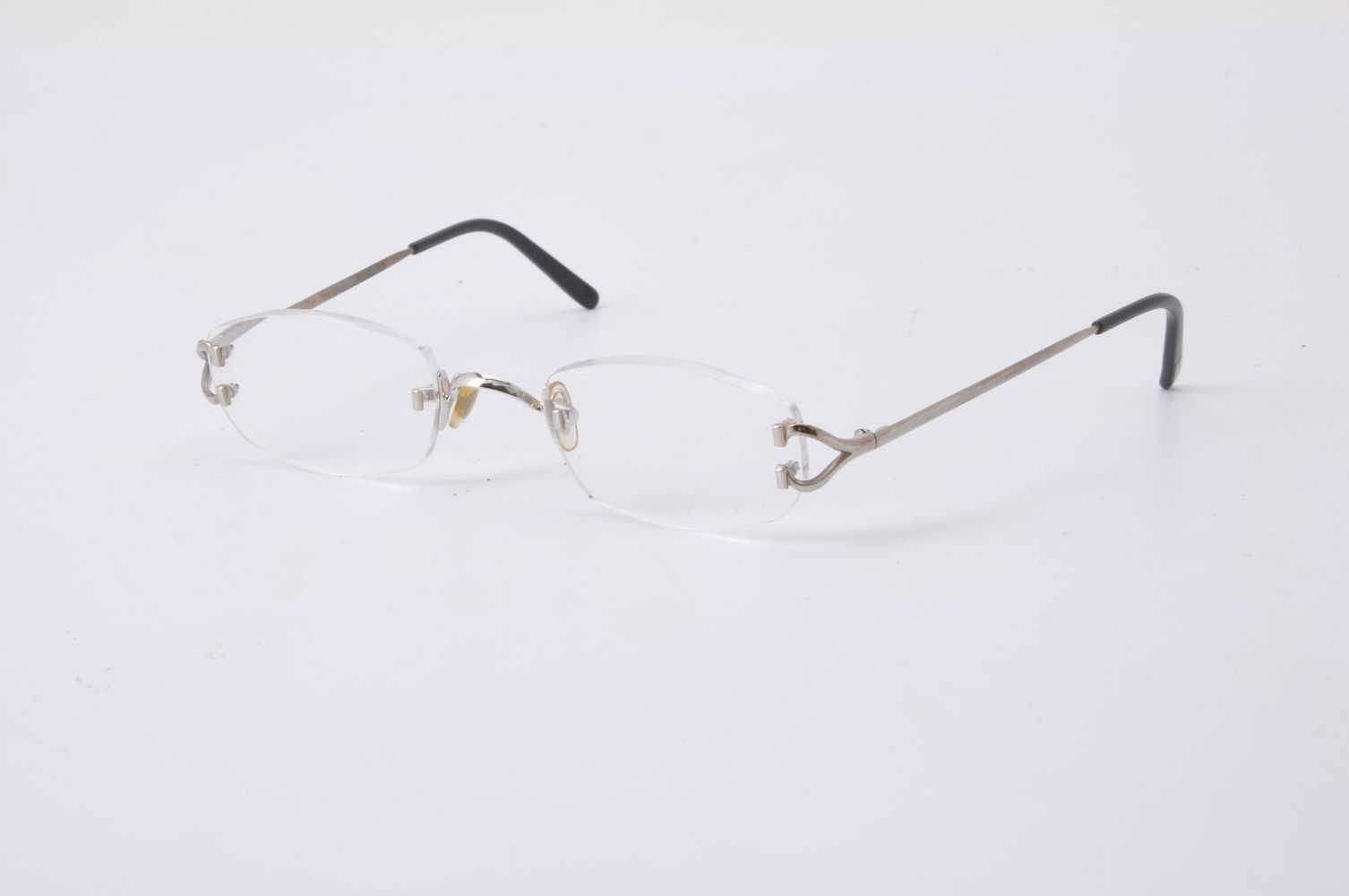 Cartier, a pair of white metal framed glasses