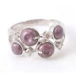 A pink bead and diamond ring