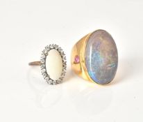An oval shape opal and white simulant stone cluster ring