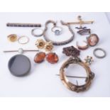 A collection of jewellery including an opal bar brooch; a blue and white sapphire bracelet and panel