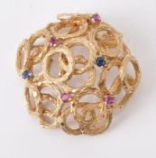 A 1960s sapphire and ruby brooch