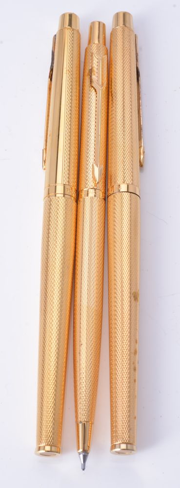 Parker, Classic Grain D'orange, a gold plated fountain pen, roller ball pen and propelling pencil