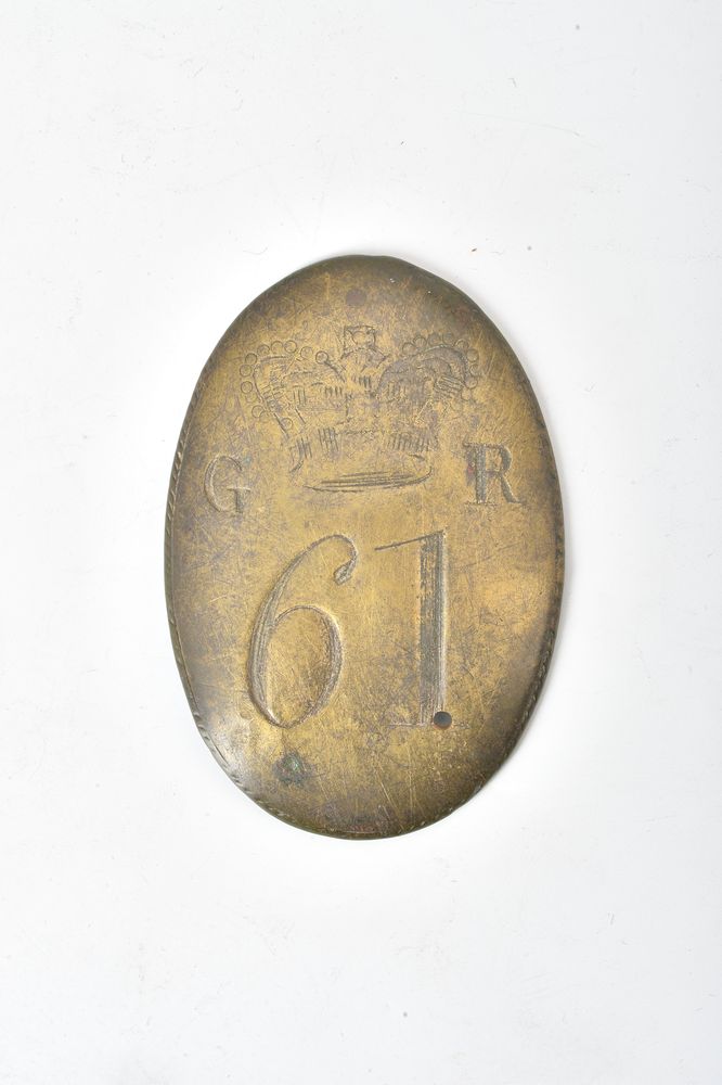 An 18th or early 19th century brass militia belt buckle