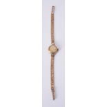 Tissot, Lady's gold and diamond bracelet watch