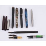 A collection of fountain pens and spare parts