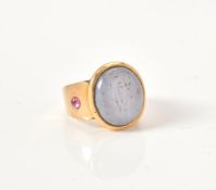 A grey star sapphire ring