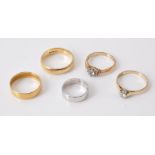 Five gold coloured rings