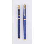 Parker, a blue marbled ball point pen and roller ball pen