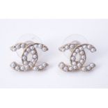 A pair of simulated pearl earrings by Chanel