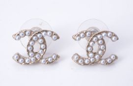 A pair of simulated pearl earrings by Chanel