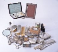 A group of silver coloured items and other objects