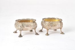 A pair of George IV silver oval salt cellars