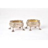 A pair of George IV silver oval salt cellars