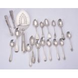 A small collection of silver flatware