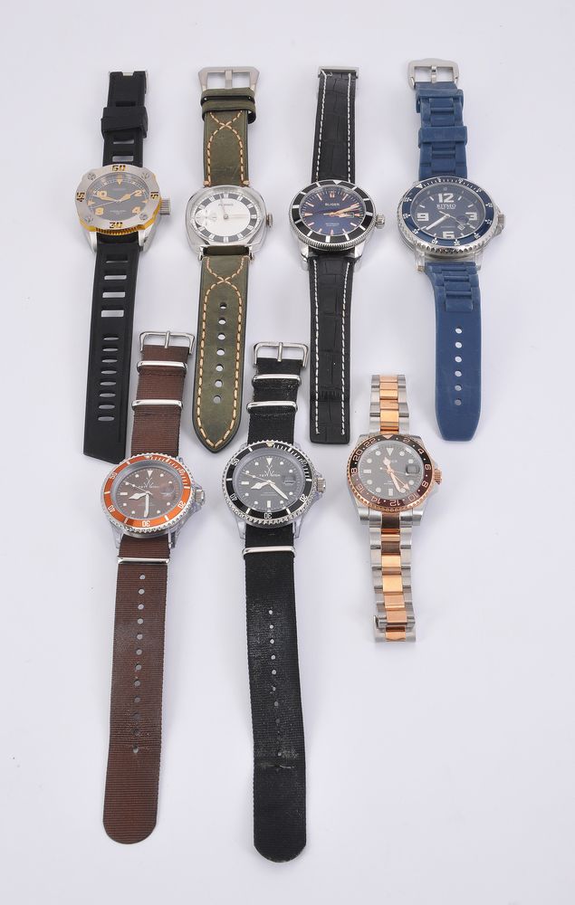 A collection of seven diver style watches