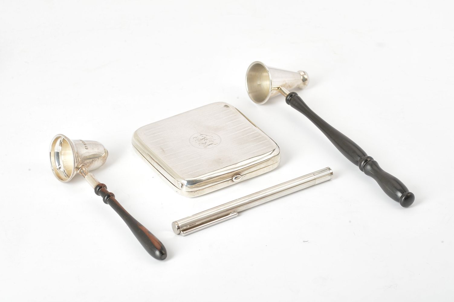 Two silver candle snuffers with turned wood handles