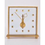 An unsigned brushed brass skeleton clock