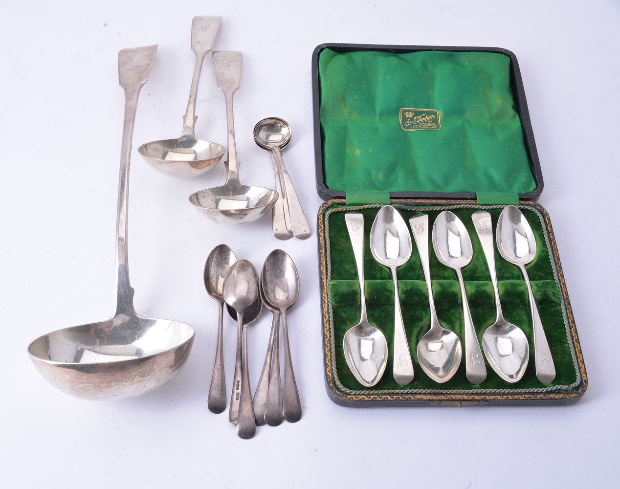 A small collection of silver ladles and spoons