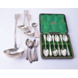 A small collection of silver ladles and spoons