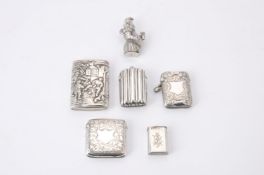 A silver coloured novelty Mr. Punch vesta case and others
