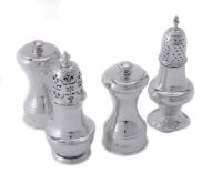 Two silver pepper casters and two pepper mills