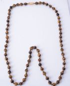 A single strand tiger's eye bead necklace