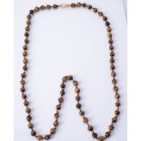 A single strand tiger's eye bead necklace