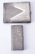 Two Italian silver coloured cigarette cases