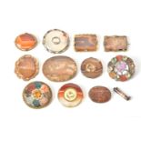 A collection of twelve hardstone brooches