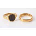 A 22 carat gold hardstone signet ring