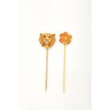 Two stickpins: - A 19th century gold hollow lion mask stickpin