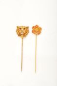 Two stickpins: - A 19th century gold hollow lion mask stickpin