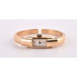 Unsigned,Lady's gold coloured bangle watch