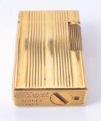 S. T. Dupont for Hermes, a gilt metal lighter